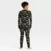 Kids' Halloween Dino Skeleton Matching Family Pajama Set - Hyde & EEK! Boutique™ Black 1 Kids' Halloween Dino Skeleton Matching Family Pajama Set - Hyde & EEK! Boutique™ Black -Hyde & EEK! Shop unnamed file 312